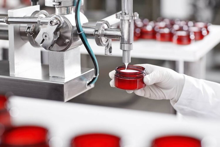10 dosing-filling-container-with-cream-cosmetic-factory_273609-13412